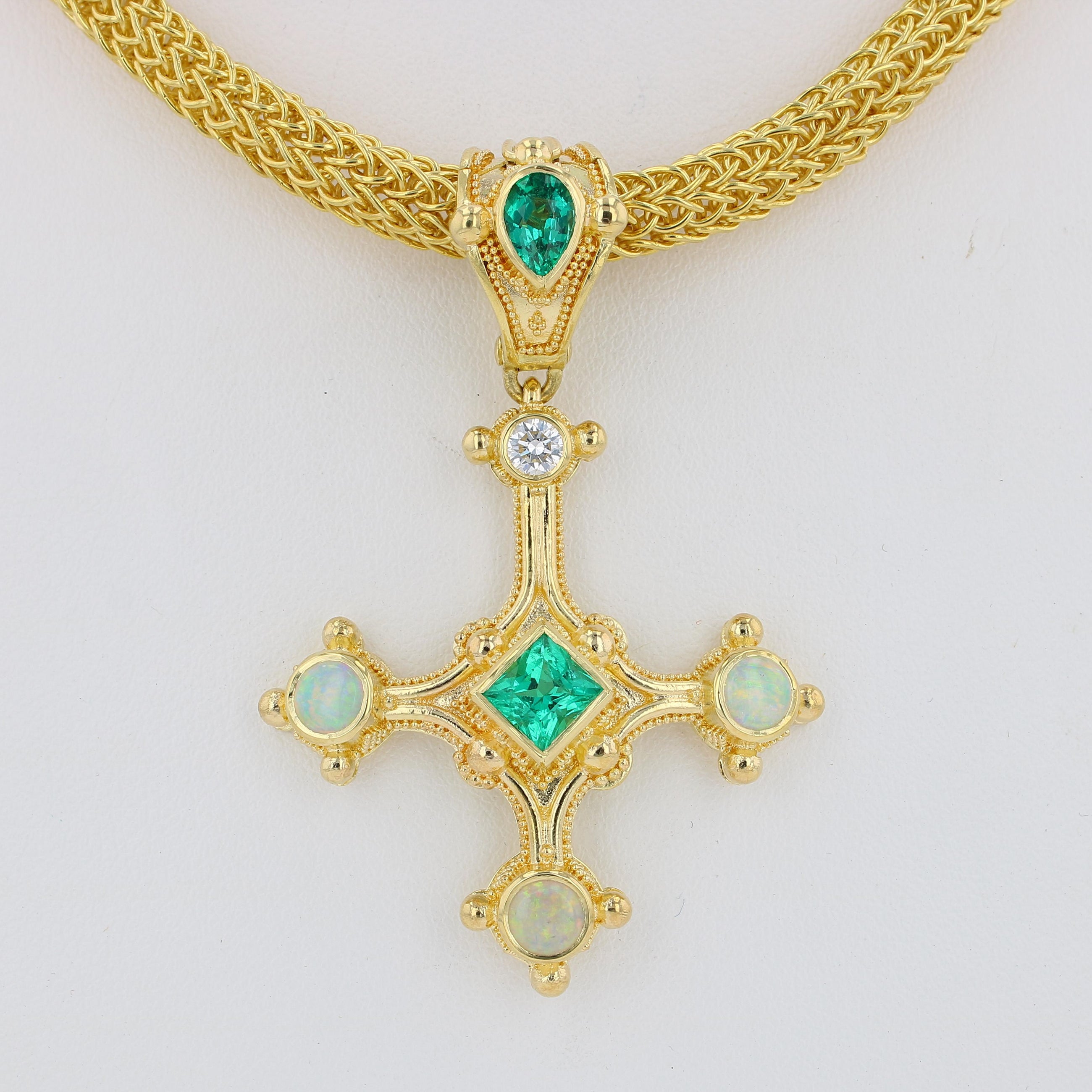 Emerald cross pendant