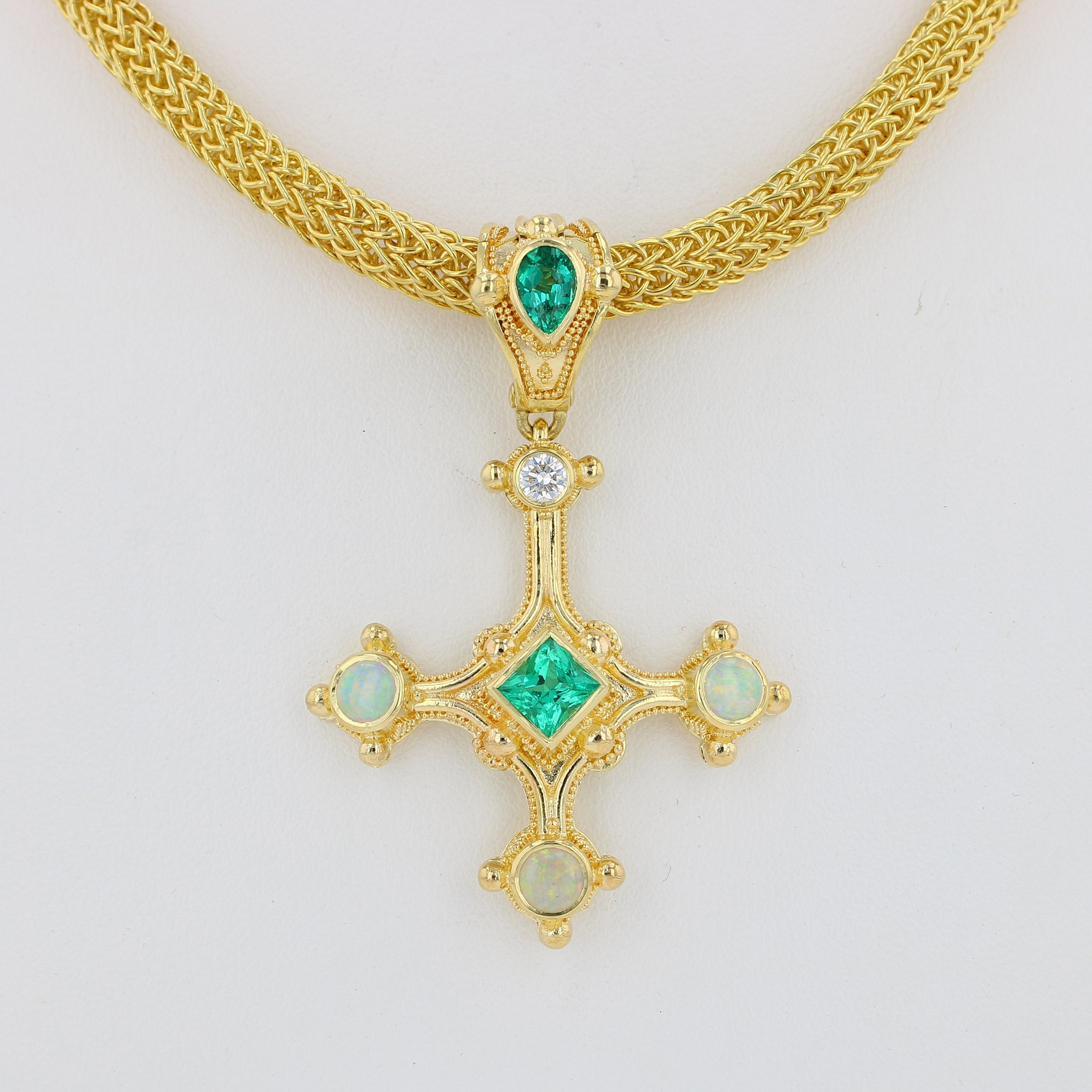 Emerald cross pendant