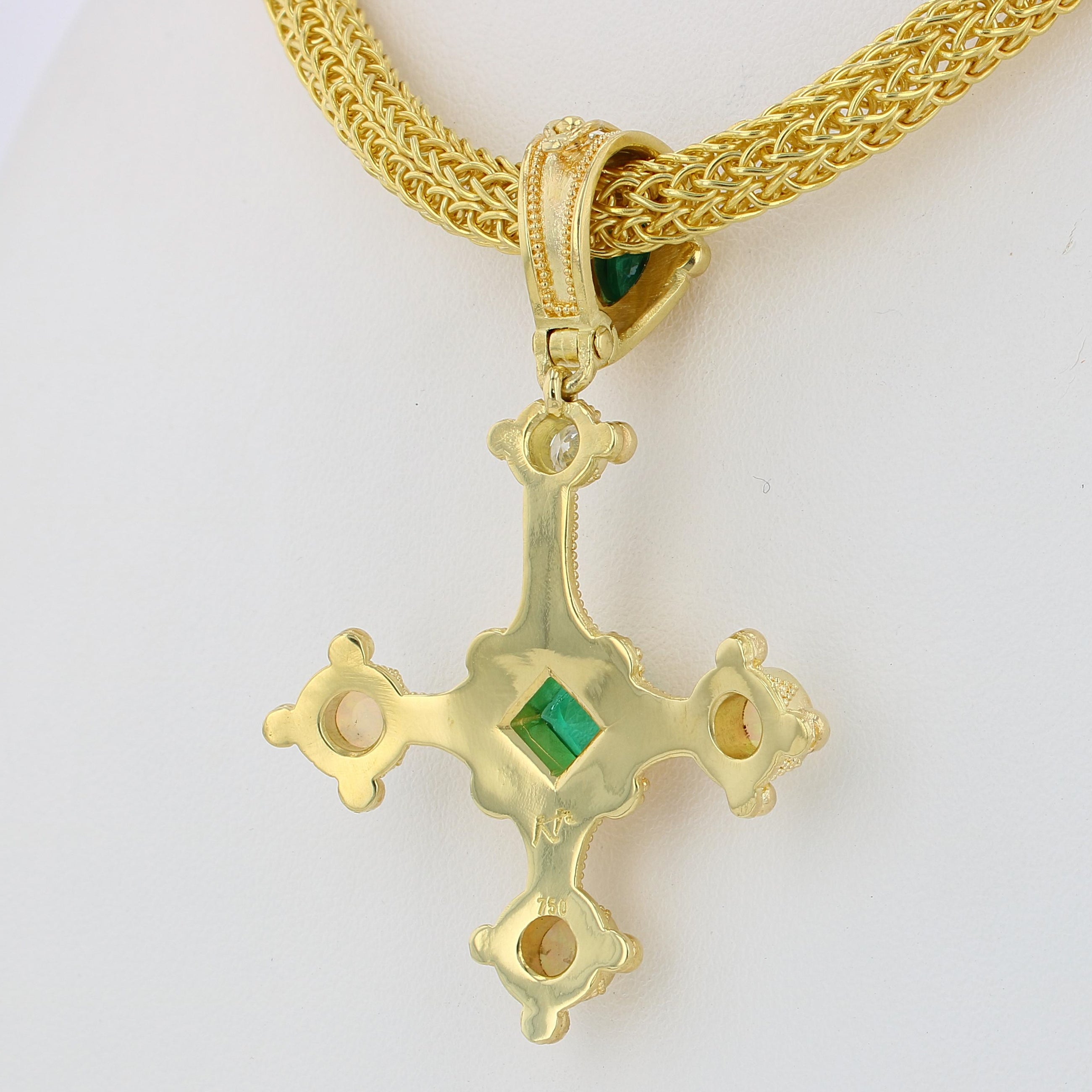 Emerald cross pendant