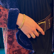 Flat woven bracelet with diamonds